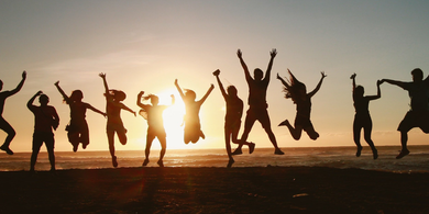 Happy people in sunset