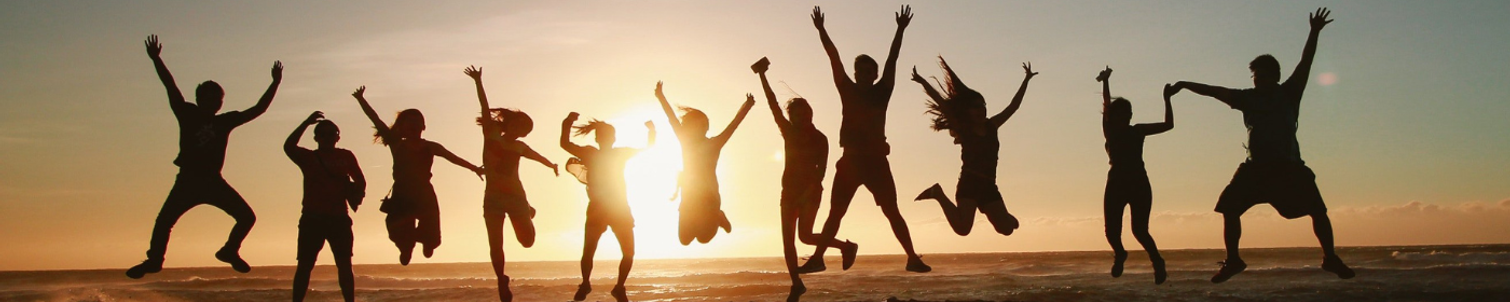 Happy people in sunset