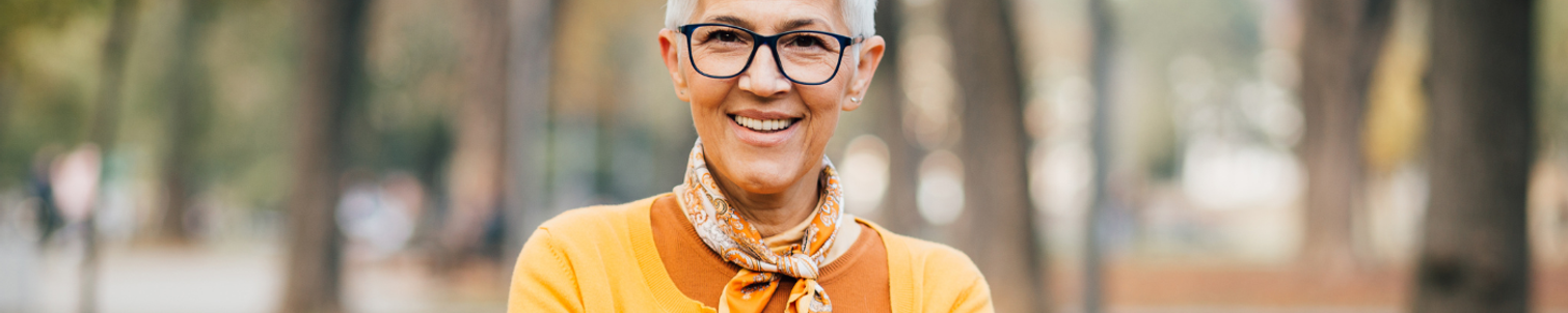 Woman over 50 wearing orange