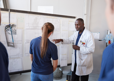 An apprentice learning on the job.