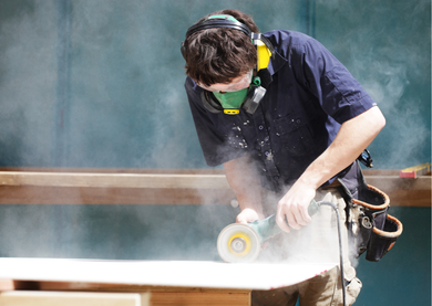 Apprentice at work, doing joinery.