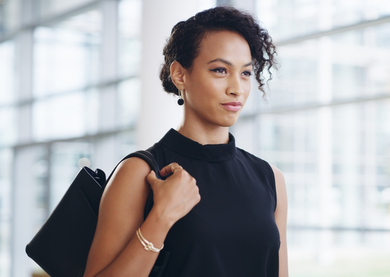 A confident woman walking to work