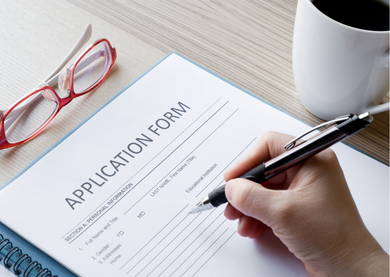 Person filling out an application form