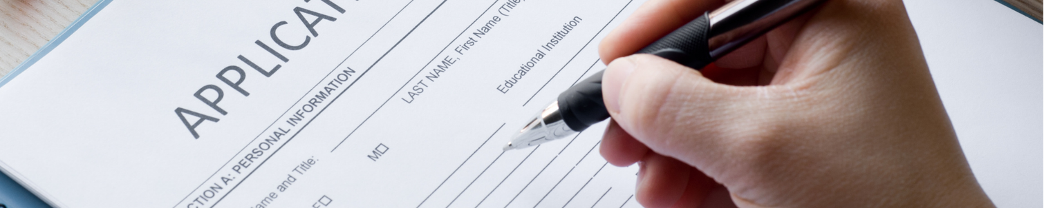 Person filling out an application form