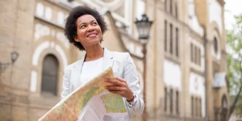Business-woman looking at a map